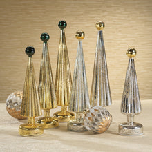 Load image into Gallery viewer, Assorted ribbed glass cone trees in gold and silver finishes topped with glossy round finials in dark green and gold, arranged with two faceted decorative spheres on a neutral surface with a softly patterned beige backdrop.