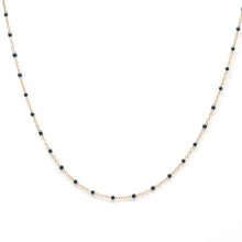 Load image into Gallery viewer, Necklace with dark blue beads on a gold chain against a white background