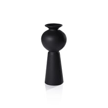 Load image into Gallery viewer, A matte black modern vase with sculptural silhouettes, placed against a wooden background.