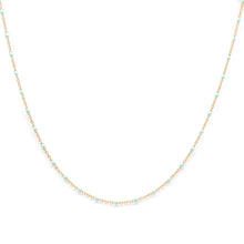 Load image into Gallery viewer, Gold necklace with small beads on a white background