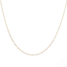 Load image into Gallery viewer, Gold chain with white beads on a white background