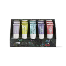 Load image into Gallery viewer, A box containing 15 watering stakes in lavender, yellow, green, purple, and pink colors, against a white background.
