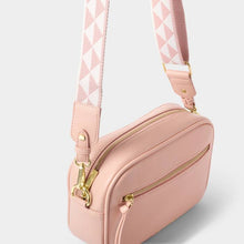 Load image into Gallery viewer, A pink crossbody bag with gold hardware, with a pink and white checkered strap. On a white background.