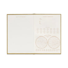 Load image into Gallery viewer, A gold colored journal opened to two white informational pages. The header of the left page has "BULLET/ KEY CONTENTS" in gold print.  The right page has " PERSONAL INFORMATION" in gold print as the header , and an area to write information. Right page also has "WORLD CLOCK" in gold print with 14 clocks . Against a white background.
