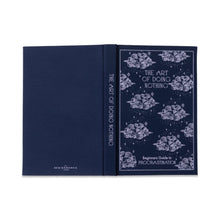 Load image into Gallery viewer, Navy- colored journal lying flat with spine up. Front cover of the journal is navy colored with a white whimsical cloud design, and "THE ART OF DOING NOTHING" in white text at the top . "Beginners Guide To PROCRASTINATION" in white text at the bottom. 
Journal spine is navy colored with "THE ART OF DOING NOTHING" in white text.
Back cover of journal is navy colored with "DREAM WORKS" at the bottom in white text. Against a white background.