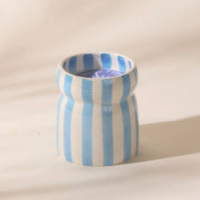 Load image into Gallery viewer, Blue striped ceramic candle . White background.