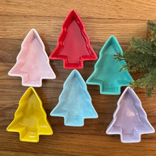 Load image into Gallery viewer, Colorful stoneware tree-shaped bowls in pink, red, green, yellow, light blue, and purple, arranged on a wooden surface with greenery on the right side.