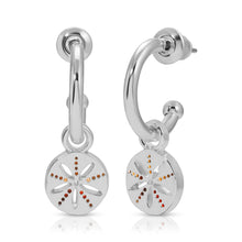 Load image into Gallery viewer, Pair of hoop earrings dipped in sterling silver featuring small round sand dollar charms accented with tiny amber, brown, and red stones, displayed against a white background. 