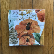 Load image into Gallery viewer, Set of white cocktail size paper napkins with a harvest theme in plastic packaging. White label on the upper left corner. &quot;ihr&quot; and &quot;SINCE 1977&quot; in black on the white label. Harvest theme includes orange pumpkins, white berries, brown pinecones, and green leaves.
On a brown wooden plank surface.