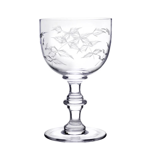 Stemmed goblet with etched leaves. White background. 