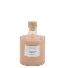 Load image into Gallery viewer, Square shaped bottle with a white label and &quot;ARCHIPELAGO&quot;,  &quot;CHARCOAL ROSE&quot;, and &quot;BUBBLE BATH&quot; in black text. Bottle filled with a peach-colored liquid, with an elongated, round neck and a cream-colored cap displayed against a white background. 