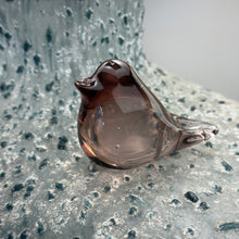 Load image into Gallery viewer, Mini pink translucent glass bird figurine with rounded body and smooth glossy surface, resting on textured blue surface.
