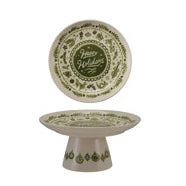 Load image into Gallery viewer, Holiday Pedestal, cream stoneware pedestal with a round raised-rim top, green holiday illustrations, and a flared base, shown in top and side views against a white background.