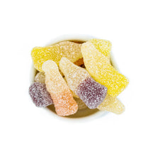 Load image into Gallery viewer, Close-up of sugar-coated sour soda bottle gummy candies in a small bowl on a white background. 