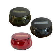 Load image into Gallery viewer, Three glass jars with lids on a white background. Colors of jars are green, dark gray, and red.