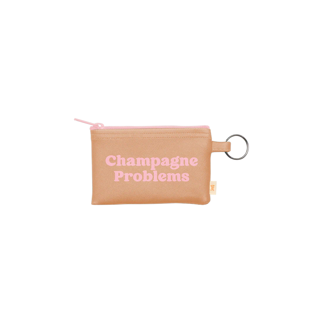 Beige vegan leather pouch with a pink zipper and a silver key ring, printed with the phrase 