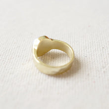 Load image into Gallery viewer, Back side of a 14k gold semi-matte double plated brass casting ring. On a cream woven fabric surface. 