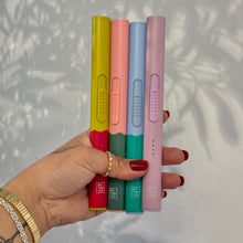 Load image into Gallery viewer, Four flameless rechargeable lighters in assorted colors, shown held in hand against a light background.