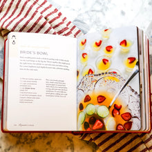 Load image into Gallery viewer, Open "Romantic Cocktails" recipe book showing "Bride's Bowl" punch recipe with photo of the fruit punch in a glass bowl.