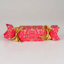 Load image into Gallery viewer, Granado Flora Magnifica scented cracker with bright pink packaging, gold botanical pattern, and gold ribbon bows on a white background.