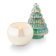 Load image into Gallery viewer, Fresh Balsam Pearl Tree Candle, candle with cream wax and an unlit wick in a smooth round pearl-finish glass vessel, with a cone-shaped, tiered tree lid featuring ribbed details and an iridescent green finish with pink and gold sheen behind it, against a white background. 