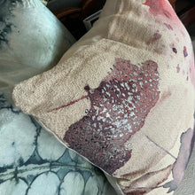 Load image into Gallery viewer, Abstract Printed Pillow, square textured fabric pillow with dusty pink and plum watercolor pattern and subtle silver metallic details, shown in close-up with layered pillows in the background. 