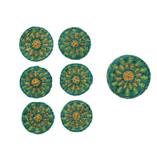 Load image into Gallery viewer, Set of eight green and yellow woven coasters on a white background.