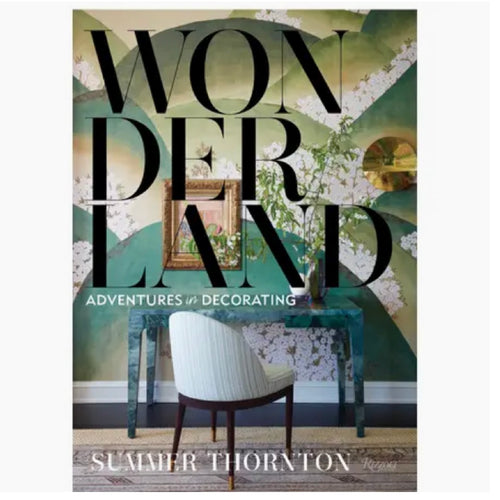 Hardcover book with a table and desk on the cover and a geometric wall background. Title is in bold black letters and reads 