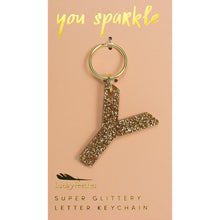 Load image into Gallery viewer, Gold glittery letter &quot;Y&quot; keychain on a pink card with &quot;you sparkle&quot; in gold text, displayed against a white background. 