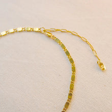 Load image into Gallery viewer, Ion-plated gold plated brass casted bar chain necklace with reflective, light-catching links and a 2" extender, displayed on a soft white textured background.