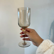 Load image into Gallery viewer, Hand holding a crystal red wine glass in an organic color.