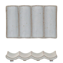 Load image into Gallery viewer, An overhead and side view of a white stoneware soap dish with 3 prominent vertical ridges, against a white background.