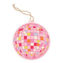 Load image into Gallery viewer, Round pink air freshener shaped like a disco ball with a red, orange, yellow, and blue checkered pattern and white star highlights, hanging from a cream-colored string against a black and gray background. 