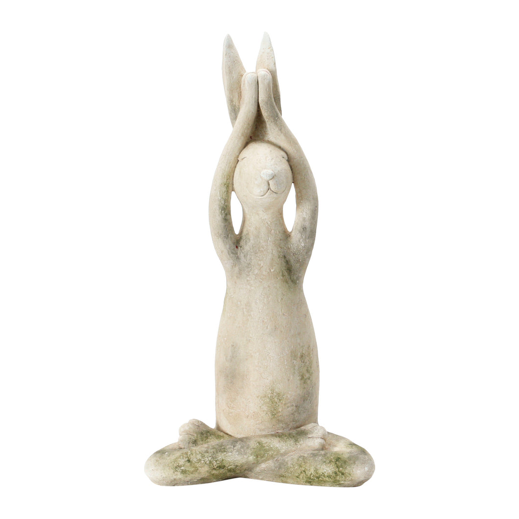 A white antiqued -colored resin rabbit sitting in a yoga pose against a white background.