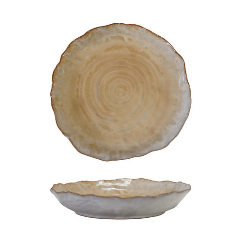 Organically round beige ceramic plate with textured surface on a white background.
