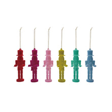 Load image into Gallery viewer, Six nutcracker drummer ornaments in red, magenta, pink, lime green, teal, and blue, each holding a small drum and drumsticks hanging from a gold cord against a white background. 