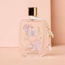 Load image into Gallery viewer, Large Lollia No 19 perfume bottle with floral design and gold cap on a pink background