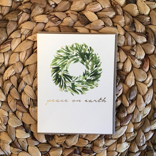 holdiday card with white background and gold writing 