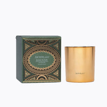 Load image into Gallery viewer, Metallic gold 10 oz. candle with its decorative hunter green and metallic gold box displayed on a white background
