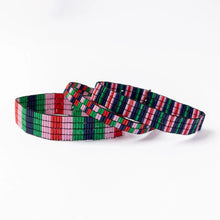 Load image into Gallery viewer, Three beaded stretch bracelets with different geometric patterns and colors , including :red, pink, blue, and green. On a white background.
Ethically produced from India.