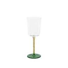 Load image into Gallery viewer, Clear white wine glass with an amber stem and a green circular base displayed on a white background. 