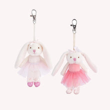 Load image into Gallery viewer, Two plush white bunny bag charms hanging from silver lobster-clasp clips, each wearing a white bow and a ballerina dress- one in a pale pink tulle dress with pink glitter slippers, and the other in a brighter pink tulle dress with white slippers- displayed against a white background.  