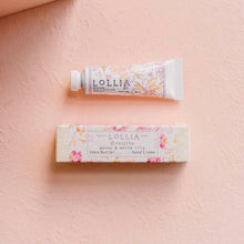 Load image into Gallery viewer, Lollia hand cream tube and packaging on a pink background