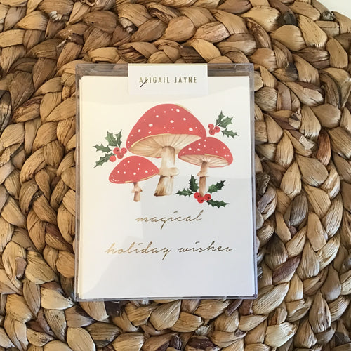 boxed holiday cards red mushrooms with gold writing 