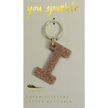 Load image into Gallery viewer, Gold glittery letter &quot;I&quot; keychain on a beige card with &quot;you sparkle&quot; in gold text, displayed against a white background. 