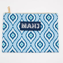 Load image into Gallery viewer, Dark and light blue geometric patterned Mahjong accessory bag with a gold zipper and a navy patch with "MAHJ" on it, displayed on a white surface.