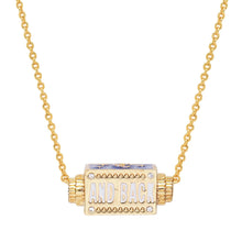 Load image into Gallery viewer, Close-up of the reserve side of a gold- plated chain spinner pendant necklace featuring the text "AND BACK," displayed on a white background. 