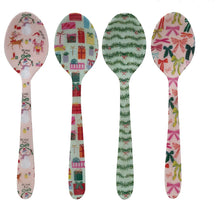 Load image into Gallery viewer, Enameled Holiday Spoons | Four Styles, four enameled stainless steel spoons with different holiday designs- Santa Claus, a snowman, and a reindeer on a light pink background; colorful wrapped gifts with bows on a mint green background; green evergreen garlands with red bows on a mint green background; and multicolored bows on a pale pink background. The spoons are arranged vertically in a row against a white background.  