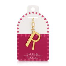 Load image into Gallery viewer, 14K gold-plated hand-painted enamel initial bag charm featuring the letter R with a scalloped edge design and a brushed gold finish, attached to a key ring a clasp. Displayed on a white and dark pink Lucky Feather card with pink dotted brush-stroke borders labeled &quot;Bag Charm Hand Painted Enamel.&quot; Displayed against a white background. 