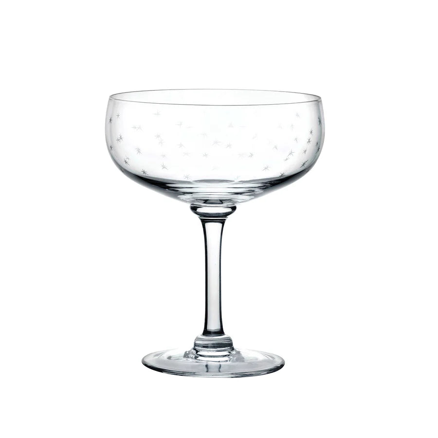 Coupe glass with small etched stars. white background